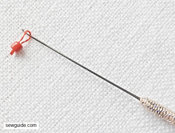 the bead is inserted into the loop