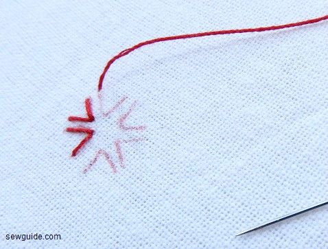 arrowhead stitch made in the shape of a flower
