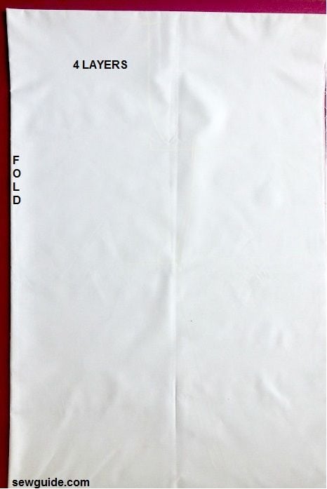 A fabric folded to mark the bodice pattern