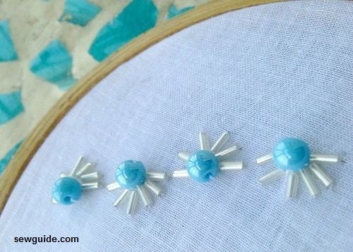 bugle beads formed around a large bead.