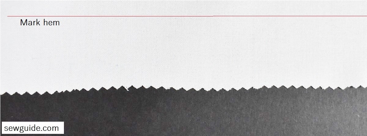 Mark the hemline on the back of the fabric; Finish the edges of the fabric