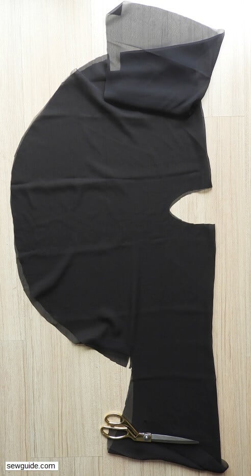 The front and back of the top laid out on top