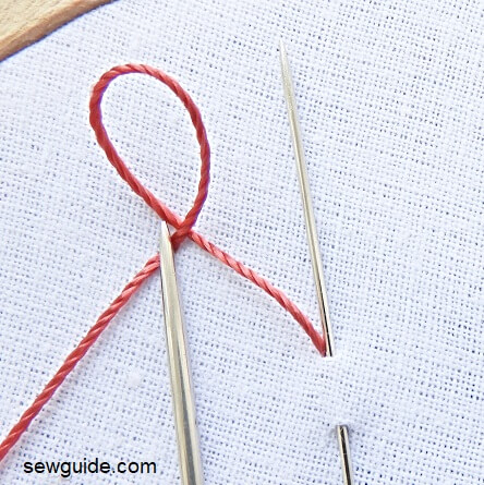 make a loop with the embroidery thread