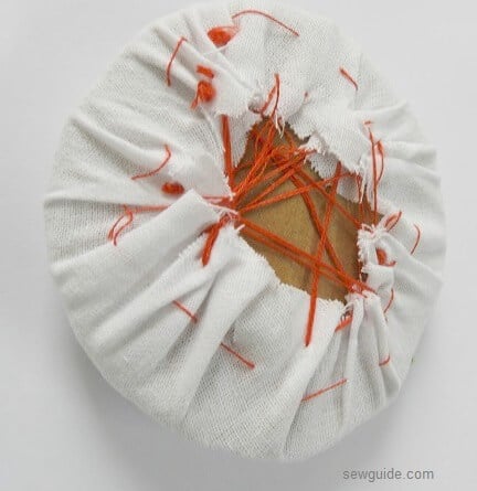 gather the thread over the cardboard