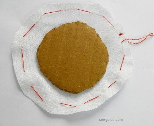 Make gathering stitches outside the fabric