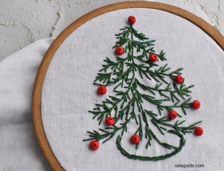 beads used to decorate an embroidered christmas tree