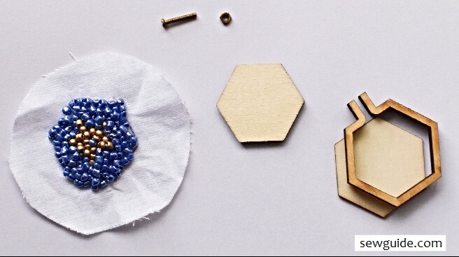 Do the bead embroidere and then insert inside the wooden pendant base.