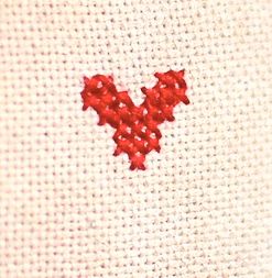 small heart shapes embroidered on baby clothes
