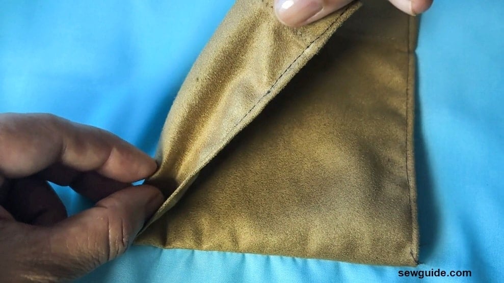 fold the side edges of the pocket