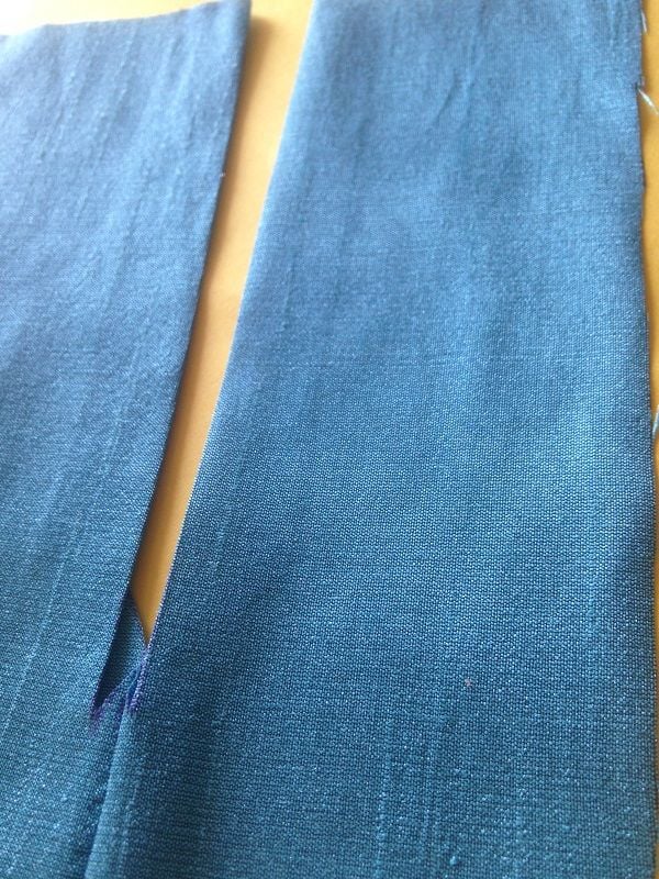 Bring the fold to the back and press in place