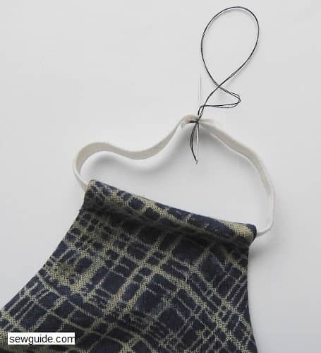 Join the edges of the elastic