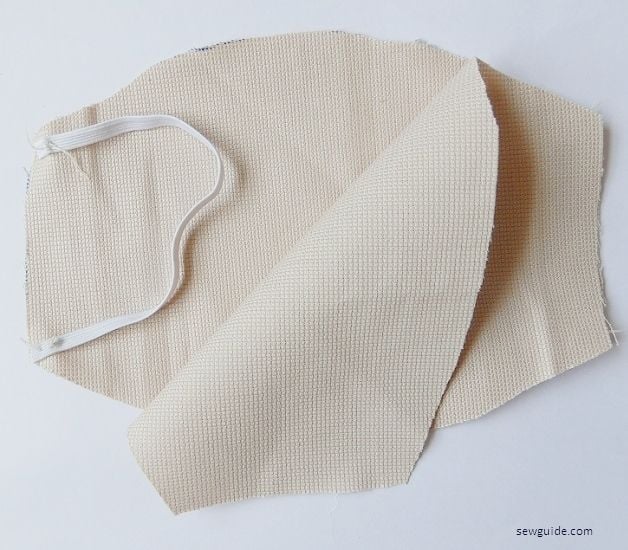 Keep the other pieces over this and sandwiching the elastic inside