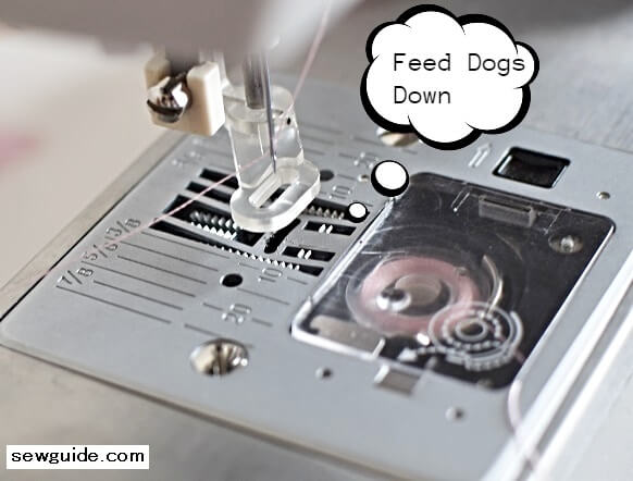 Feed dogs are pushed down