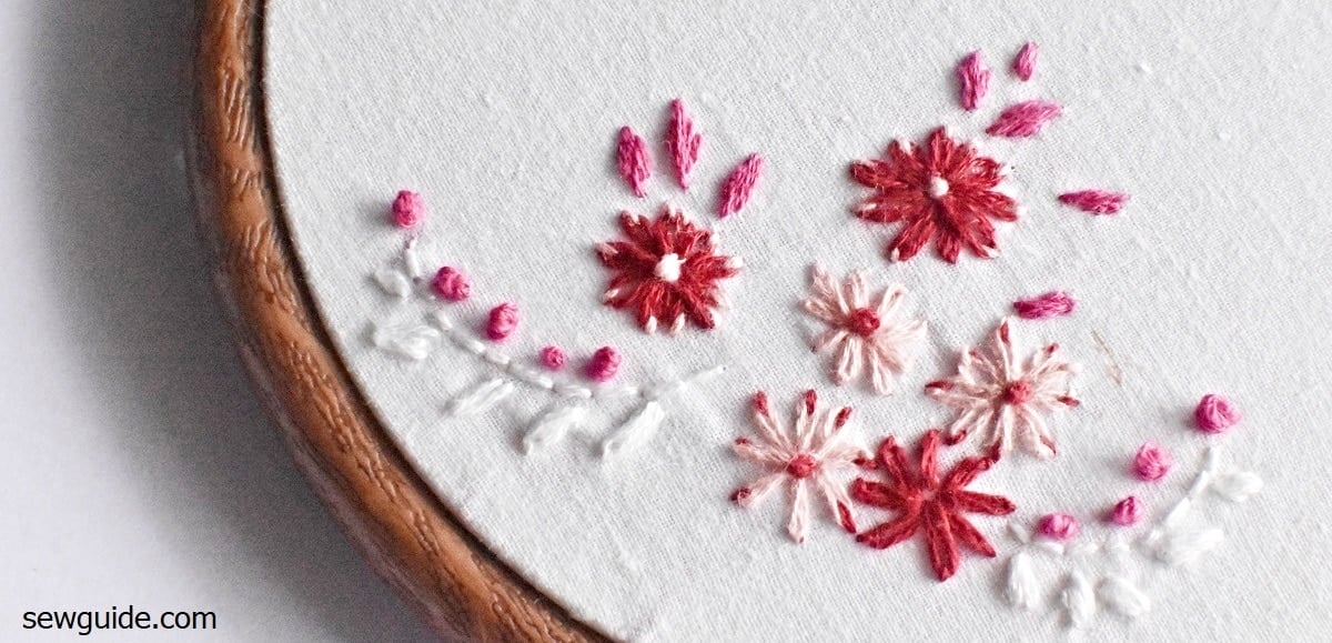 floral embroidery designs with lazy daisy stitches which are anchored with a different thread