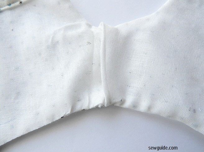 Overlap the lining from the inside and hand sew in place