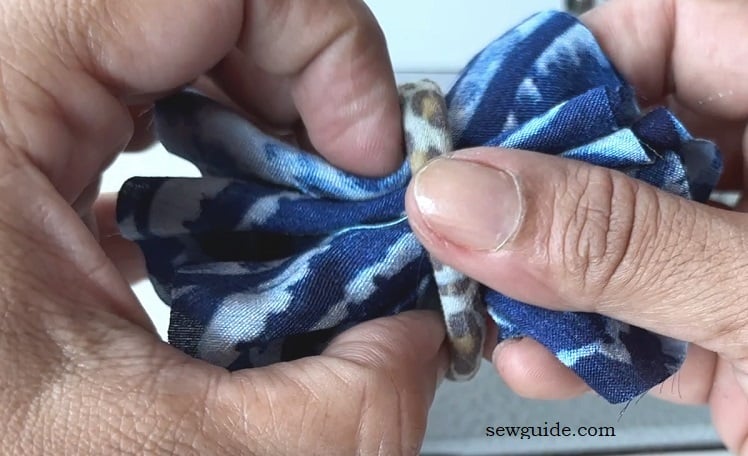keep hair tie over the fabric bunched up