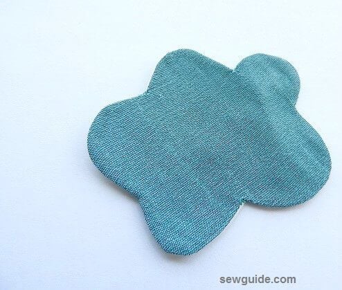 Turn the flower hand sewn applique rightside out through the cut