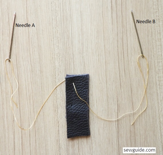 Start sewing the saddle stitch on leather with two needles