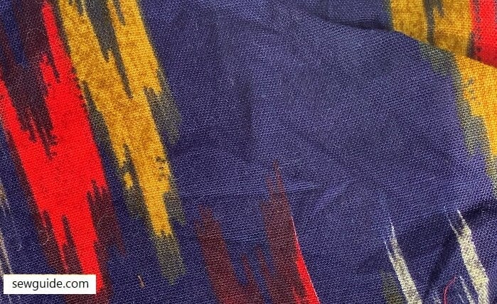 fabric with an ikat pattern as a print on the sirface