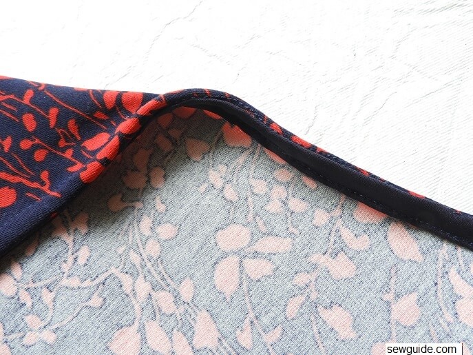 Binding at the neckline sewn to the inside