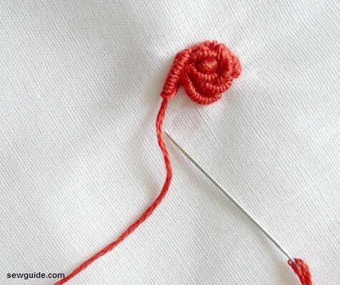 Make several bullion stitches around a point to form the rose