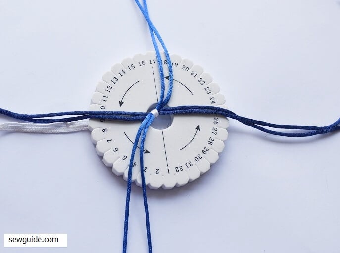 separate the braids in 4 parts through the hole