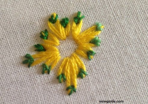 make daisy flower with lazy daisy stitches with more than one anchor stitches