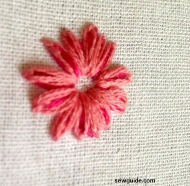 Two colored threads are used to make the lazy daisy stitch