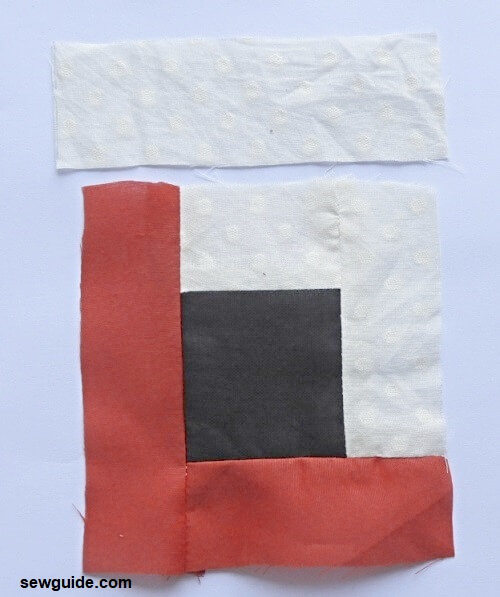 sew white fabric strip to top edge