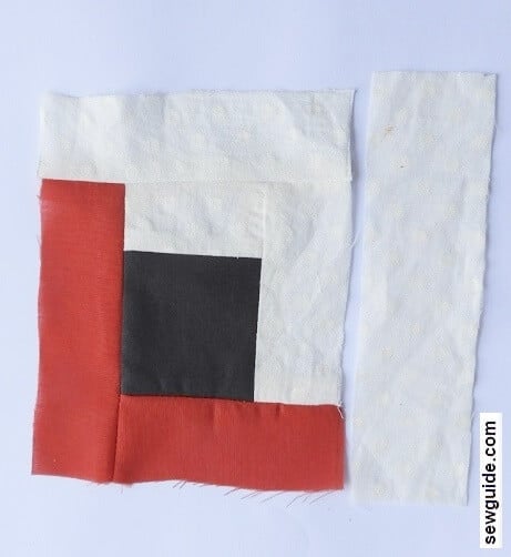 sew the white fabric strip to the right edge