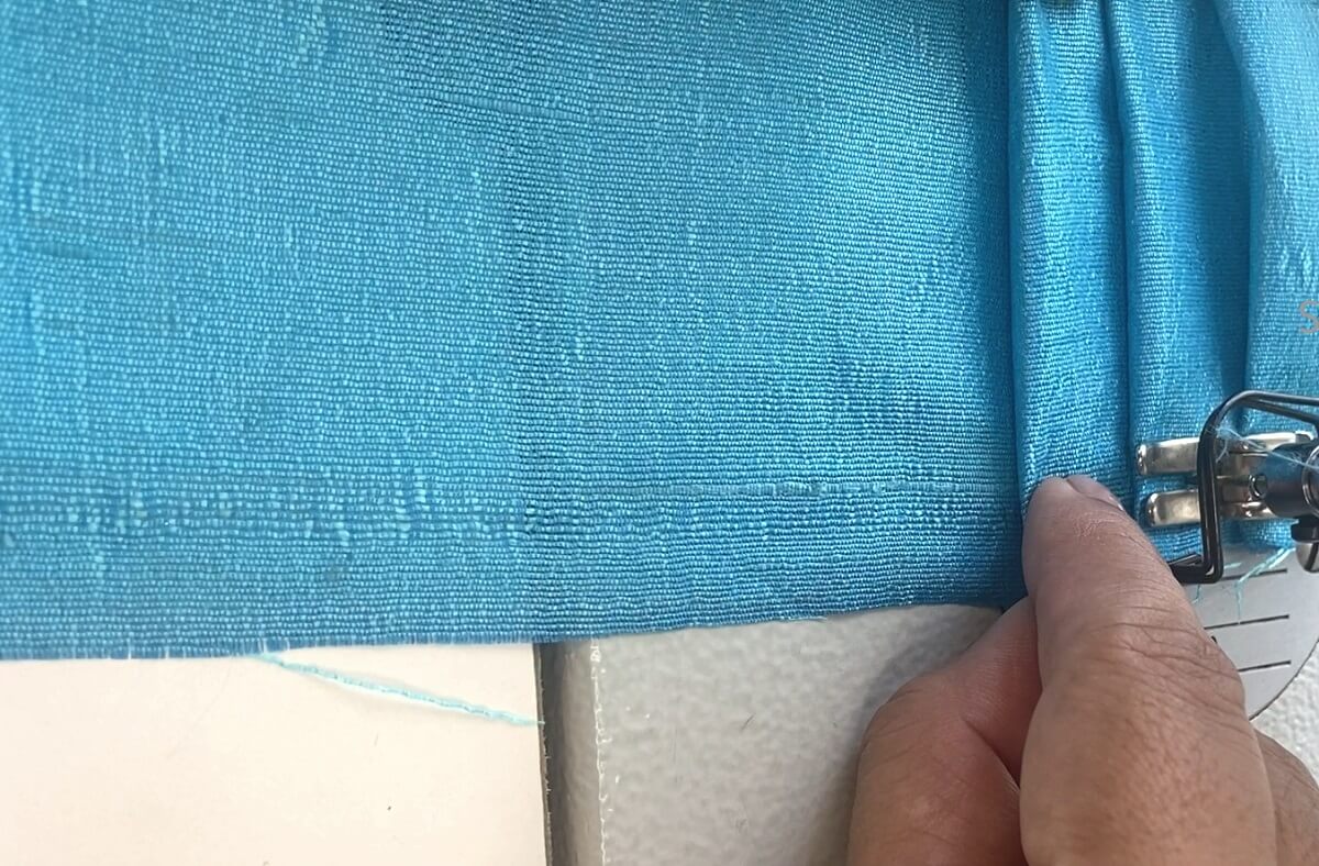 A strip of fabric pleated