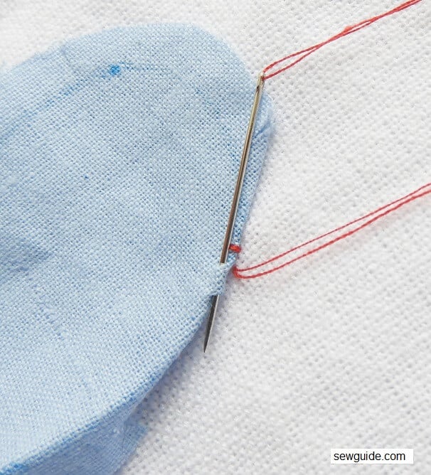 make small ladder stitches along the border to do the needle turn applique