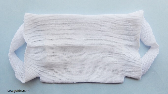 pull the cut sides to make your no sew mask