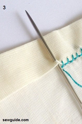 Using the thick needle sew the edge of the hem.