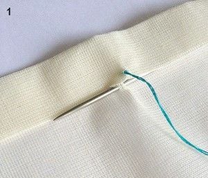 using large needle make a stitch on the hem.