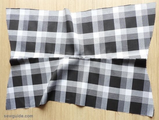 front yoke piece and the lining fabric stitched- pleated skirt