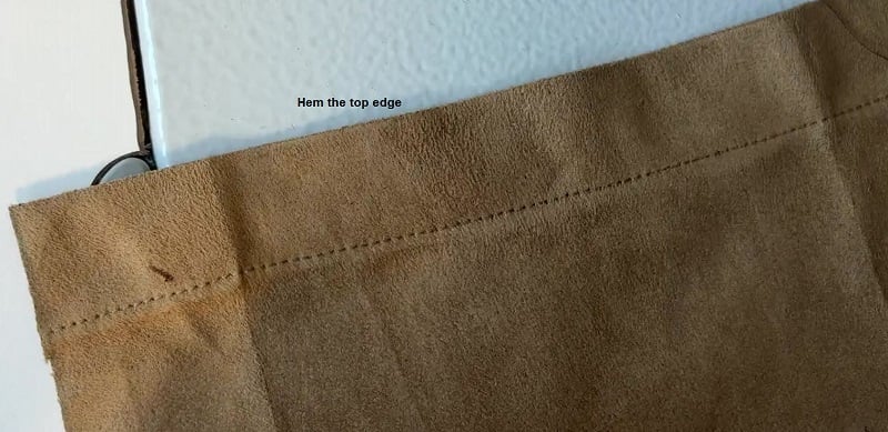 hem the top edge of the pocket