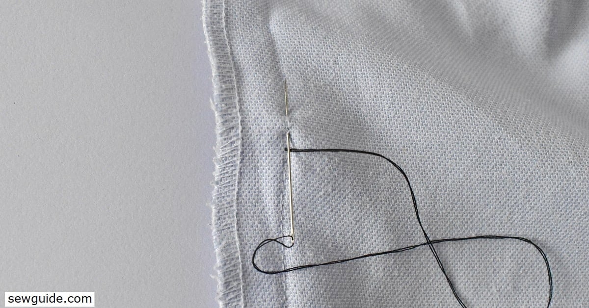 make a small stitch upwards and then bring up the needle a stitch upwards on the stitching line.