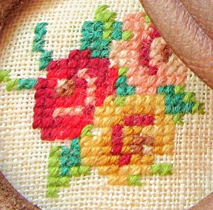 cross stitches made inside a rose drawing with shading 