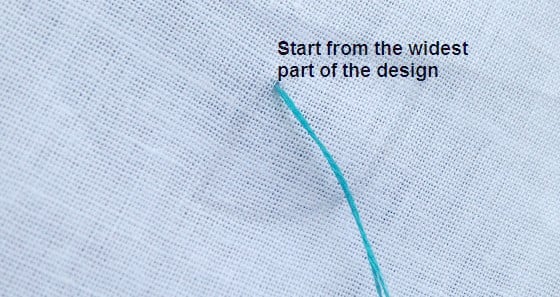 start stitching the satin stitch from the center of the design.