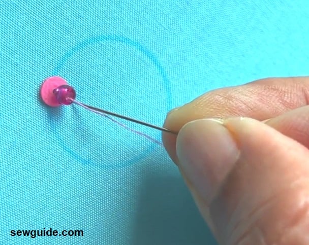 insert needle at the edge of the sequins