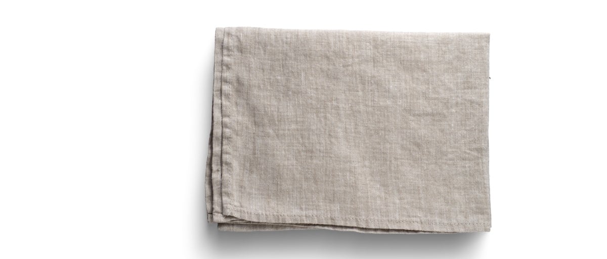 a neatly finished fabric napkin