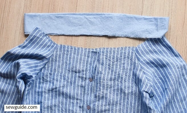 Sew the banc to the top of the shirt