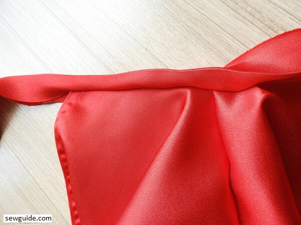 Turn the bias tape to the back 