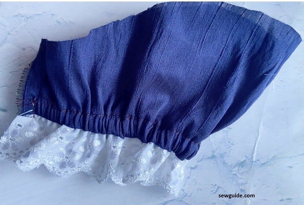 sleeve hem with ruffled lace edge
