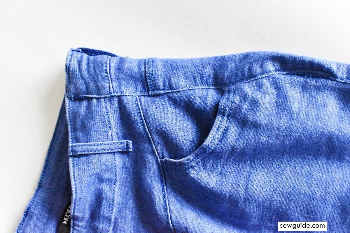 altered the loose fit waist of jeans by moving one seam over the other