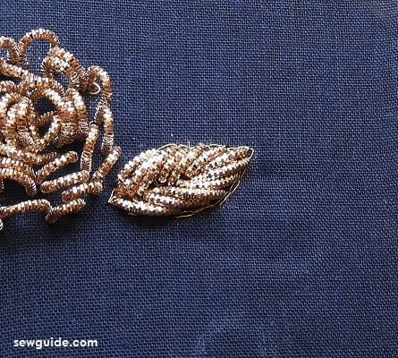 fillind the design for zardosi work with metallic thread