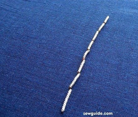 back stitches made using the metallilc thread in zardosi embroidery work