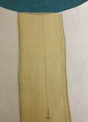 facing piece kept on the zipper line