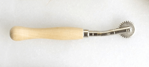 TRacing wheel for marking designs on fabric